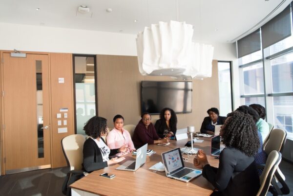Black women entrepreneurs in a meeting.