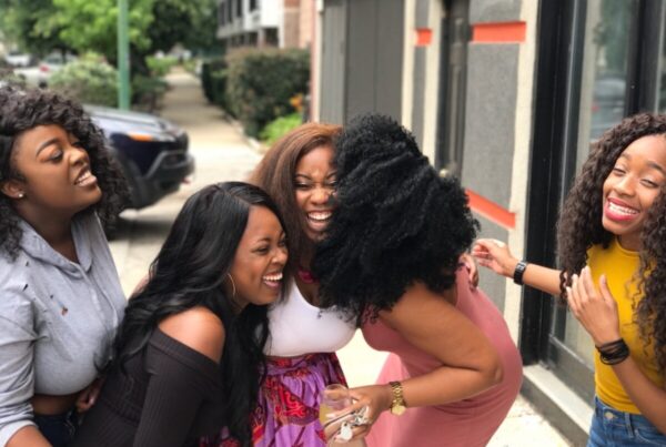 Group of Black women laughing together.