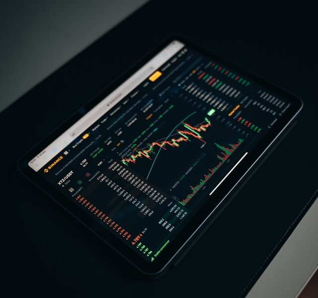stocks on tablet, desk