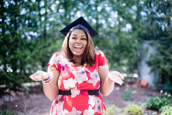 Black woman with college graduation cap.