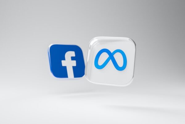 Free floating buttons with Meta and Facebook logos on them against a white background.